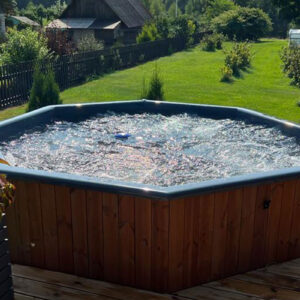 Neptune-Saunas-Stockholm-large-hot-tub---customer-garden-with-bubble-system