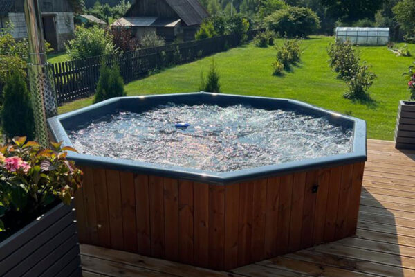 Neptune-Saunas-Stockholm-large-hot-tub---customer-garden-with-bubble-system