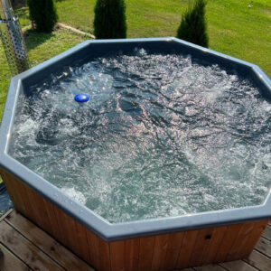 Large 10 person hot tub with bubble system in customers garden - areal view