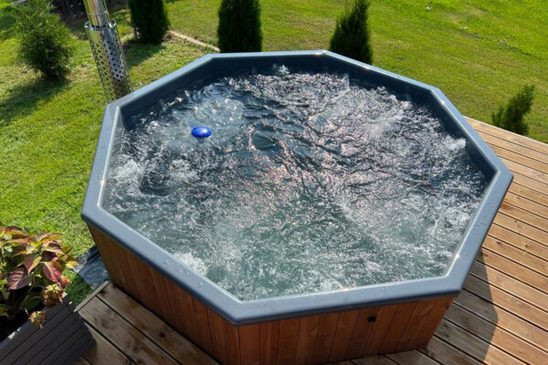Large 10 person hot tub with bubble system in customers garden - areal view