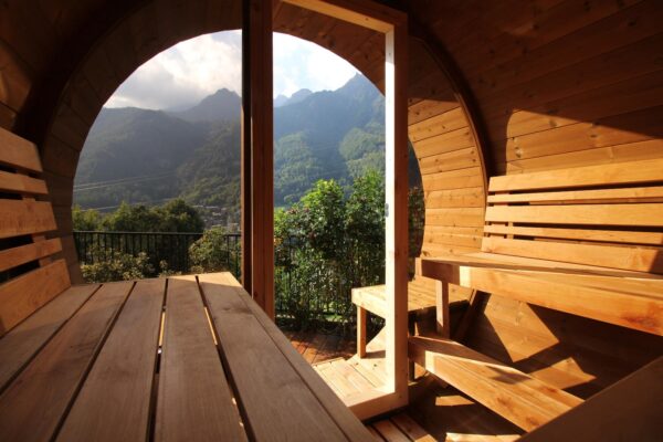 neptune barrel sauna with glass front in the mountains